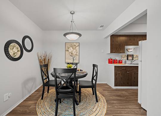 Spacious dining room area ta Knottingham Apartments in Clinton Township, MI.