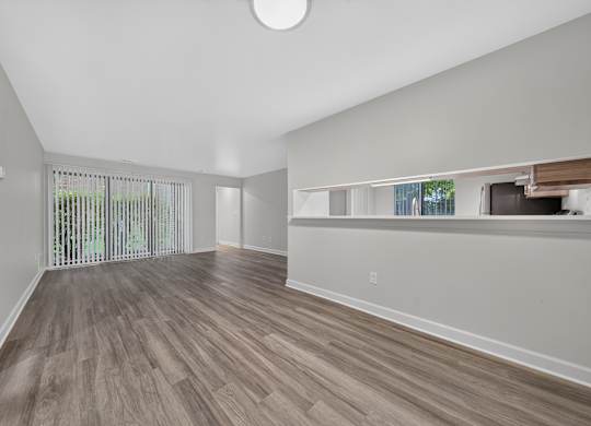 Open and airy dining and living room at Park Lane Apartments in Southfield, MI.