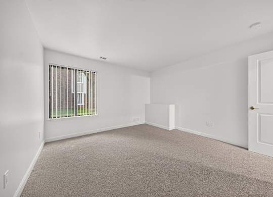 Spacious bedroom with ample storage at Park Lane Apartments in Southfield, MI.