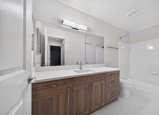 Modern bathroom with tub at Park Lane Apartments in Southfield, MI.