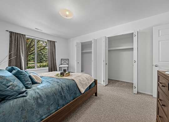 Bedroom with Ample storage space at Prentiss Pointe Apartments in Harrison Township, MI