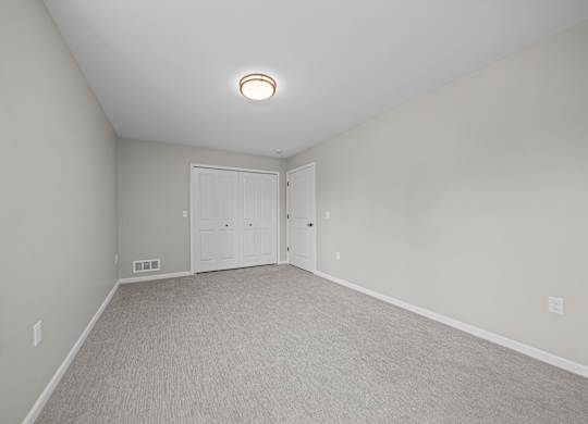 Bedroom with Ample storage space at The Reserve at Prentiss Pointe Apartments in Harrison Township, MI