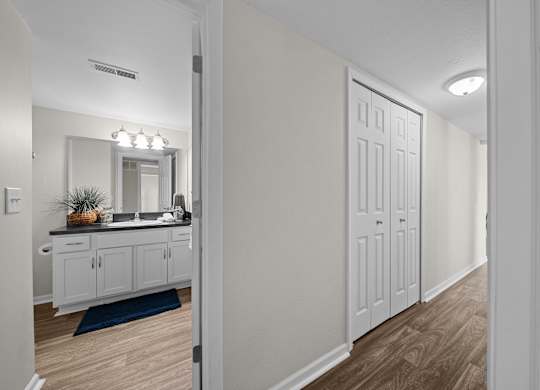 Posh bathroom with ample storage space at Three Oaks Apartments in Troy, Mi