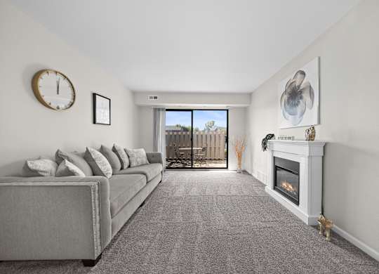 Living Room with Natural lighting  at Three Oaks Apartments in Troy, MI
