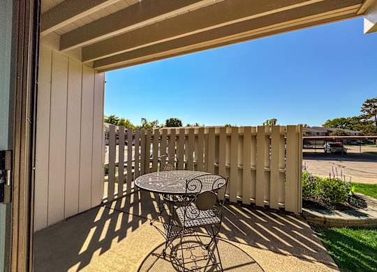 Roomy patio at Three Oaks Apartments in Troy, MI