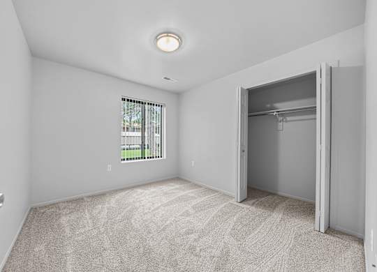 Big bedroom with natural lighting at Westwood Village Apartments in Westland, MI