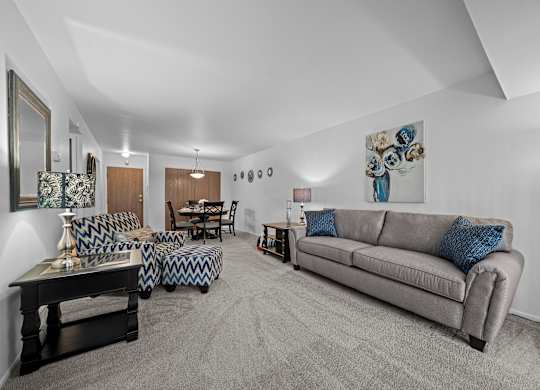Spacious living room with natural light at Westwood Village Apartments in Westland, MI