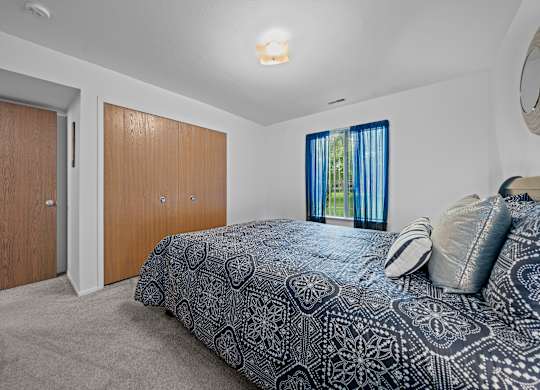 Spacious bedroom at Westwood Village Apartments in Westland, MI