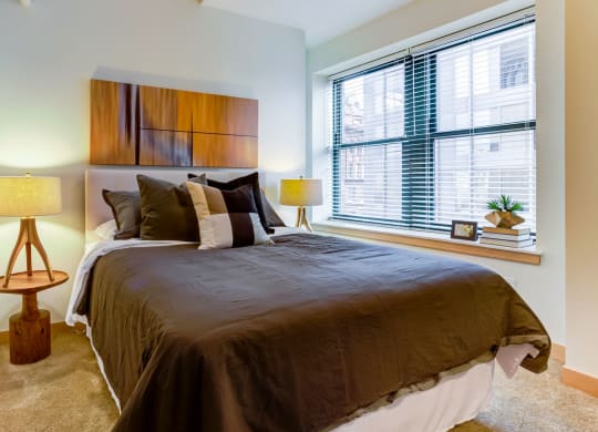 Bedroom with specious window at Arcade Artist Apartments, St Louis, MO, 63101