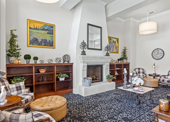 a living room filled with furniture and a fireplace at Cypress Creek at River Oaks, Waxahachie