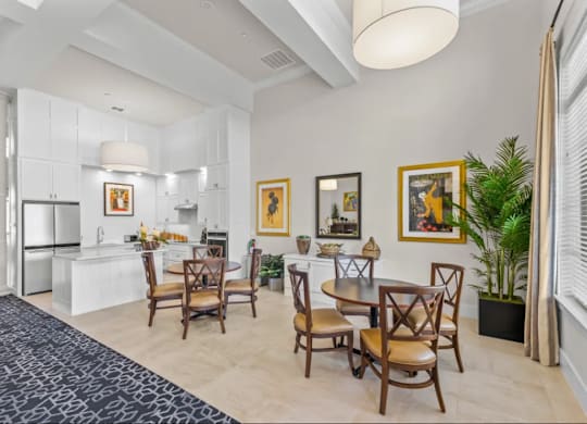 a dining room and kitchen with a table and chairs at Cypress Creek at River Oaks, Waxahachie Texas