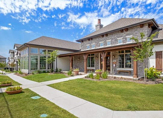 a house with a lawn and a sidewalk in front of it at Cypress Creek at River Oaks, TX 75165
