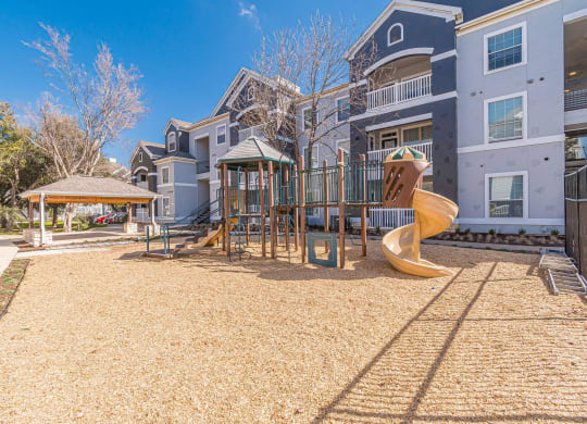playground with swing set and gazebo at Capitol Crossing, Austin, 78744