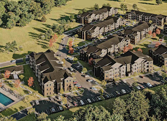 A bird's eye view of a housing complex surrounded by trees at Sage at Franklin Park Apartment , Austin, TX