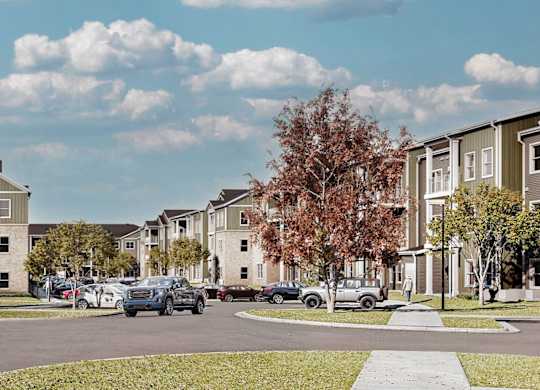 A row of houses with cars parked in front at Sage at Franklin Park Apartment , Austin, 78744