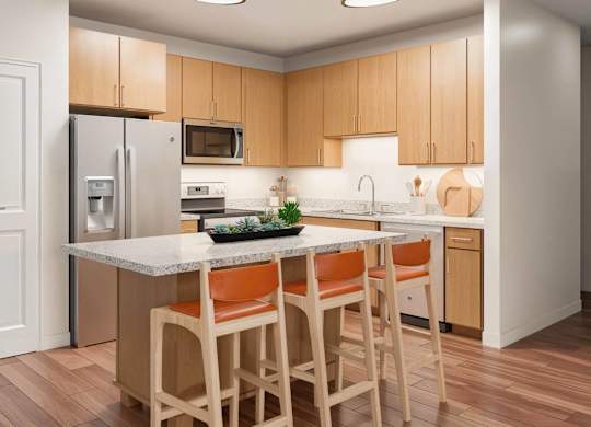 A kitchen with wooden cabinets and a marble countertop at Sage at Franklin Park Apartment , Austin, 78744