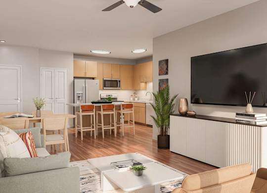 A modern living room with a grey couch, a wooden dining table, and a flat-screen TV mounted on the wall at Sage at Franklin Park Apartment , Austin, TX