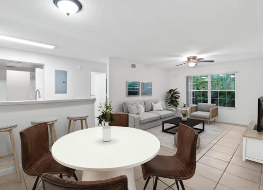 a living room with a white table and chairs