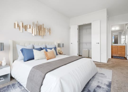 Bedroom area with cozy bed at 1500 Nicollet Apartment Homes, Minneapolis, MN, 55403