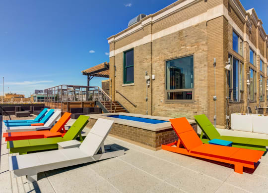 Building exterior with sitting area at Arcade Apartments, St Louis, MO, 63101