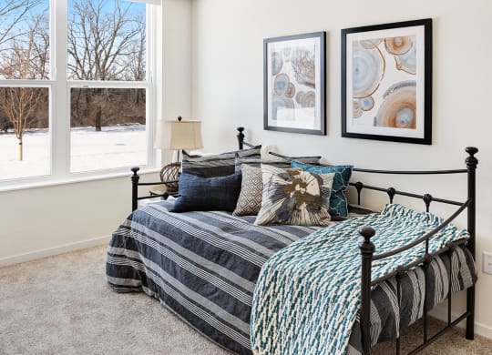 Blue Bedroom With Window at The Bluffs at Liberty Glen, Minnesota 56304