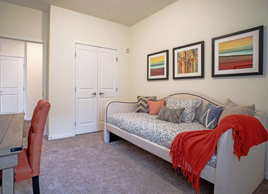 Dominium_Bren Road Station_Bedroom with wall farmes at Bren Road Station 55+ Apartments, Minnetonka, MN