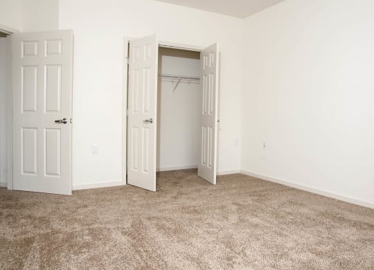 Carpeted Bedroom at The Cavanagh 55+ Apartments, Crystal