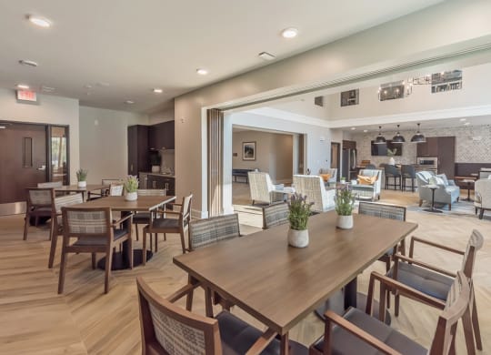 Community Room with chairs and tables at Covington Crossings 55+ Senior Living, Covington, GA, 30014