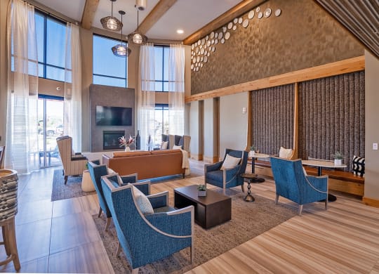 Community Room with couch at Heritage at Church Ranch 55+ Apartments, Westminster , CO 80021