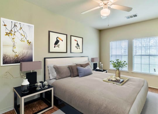 Bedroom with cozy bed at Highland Hills, Dallas, Texas
