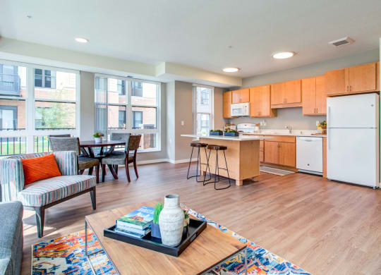 Modern Living Room With Kitchen View at The Legends at Berry 62+ Apartments, St. Paul, Minnesota