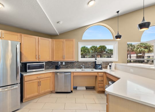 a kitchen with wooden cabinets and stainless steel appliances