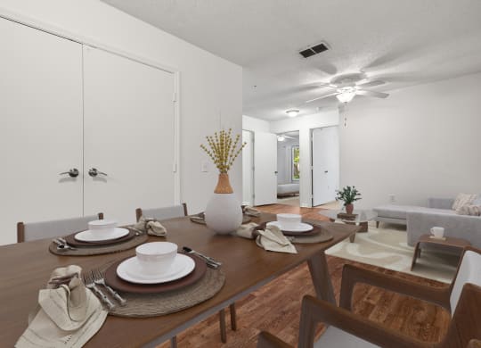 a dining room with a table and chairs and a ceiling fan