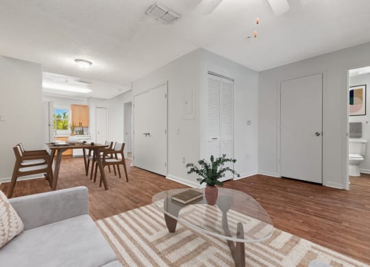 a living room and dining room with a couch and a table