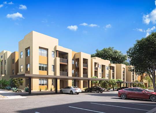 A modern apartment building with cars parked in front at Sandoval Flats Apartment , Rio Rancho, 87144