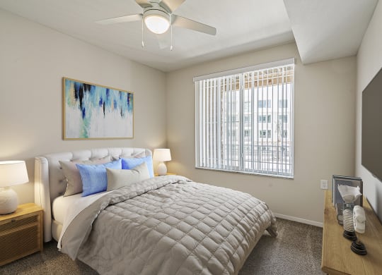 Bedroom with cozy bed at Sandpiper Glen 62+ Apartments, Orlando