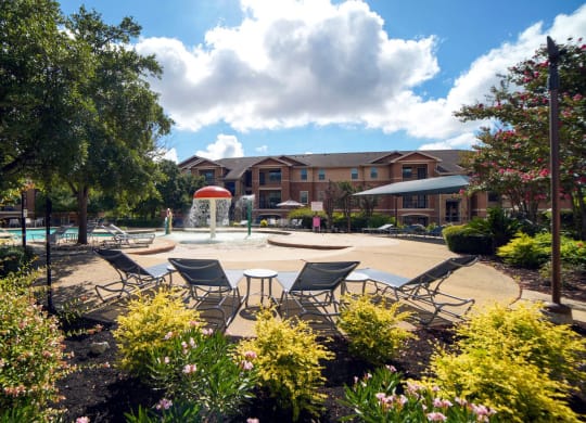 Poolside Relaxing Chairs at Stoneridge Apartments, Texas, 78660