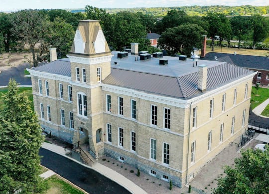 arial view of a large stone building with a towerat Upper Post Flats, Fort Snelling, MN 55111