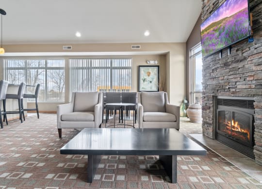 the preserve at ballantyne commons living room with fireplace and table