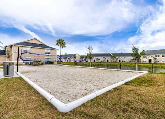 A playground with a white pipe running through the middle of it.
