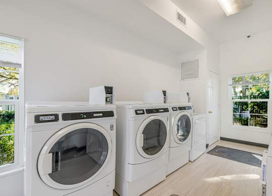 A laundry room with a washer and dryer in it.