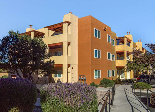 A modern building with a clear blue sky in the background.