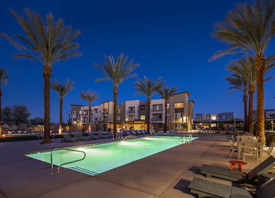 Pool view at night at Estrella Springs at Canyon Trails Apartments, Goodyear 85338