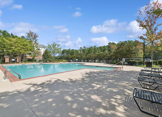 Pool With Relaxing Chairs at Falls Pointe at the Park, Durham, 27713