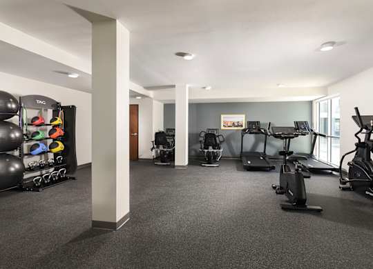 A spacious gym with a variety of exercise equipment.