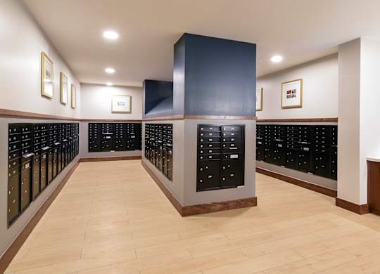 A long hallway with a row of lockers on the left and right.