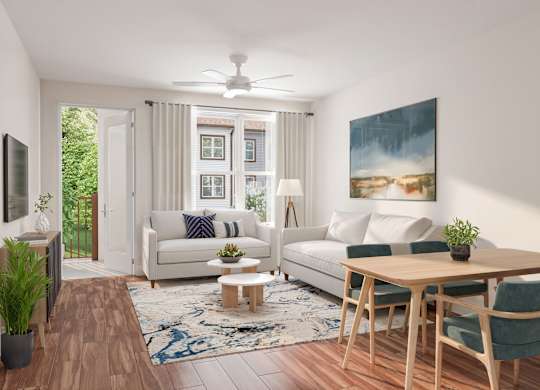 A living room with a white couch, a wooden table, and a painting on the wall at Maison at Solivita Marketplace Apartment Homes, Kissimmee, FL