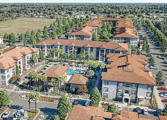 A large, well-maintained apartment complex with a pool and landscaping at Maison at Solivita Marketplace Apartment Homes, Kissimmee, 34758
