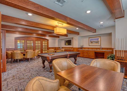 a game room with a pool table and tables at Mariposa at South Broadway, Texas