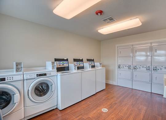 the preserve at ballantyne commons laundry room with washes and dryers at Mariposa at South Broadway, Joshua, TX